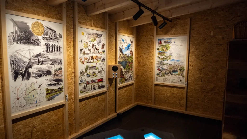 Ausstellung in kleinem Raum, überwiegend Holz, Zeichnungen und eine interaktive Tonbox